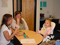 photo of the author, her baby, and a friend